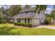 Two-story home featuring well-maintained lawn, attached garage, and a welcoming facade at 600 Dolphin Dr, Summerville, SC 29485