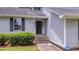 Close-up of a home's front entrance featuring steps leading up to a dark-colored door, number 600 at 600 Dolphin Dr, Summerville, SC 29485