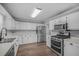 Well-lit kitchen with stainless steel appliances, white cabinetry, and ample countertop space at 600 Dolphin Dr, Summerville, SC 29485