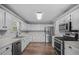 The kitchen boasts stainless steel appliances and modern cabinetry at 600 Dolphin Dr, Summerville, SC 29485