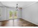 Bright living room featuring wood floors, French doors, and a ceiling fan at 600 Dolphin Dr, Summerville, SC 29485