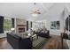 Inviting living room with a brick fireplace, vaulted ceiling, and stylish furnishings at 600 Dolphin Dr, Summerville, SC 29485