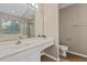 Bright bathroom with a large mirror, white vanity, and a separate glass-enclosed shower at 633 Alwyn Blvd, Summerville, SC 29485