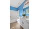 Bright blue bathroom features a tub and shower combo plus a modern white vanity at 633 Alwyn Blvd, Summerville, SC 29485