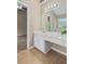 Neutral bathroom with a white vanity, large mirror, and tile floors with access to a bedroom at 633 Alwyn Blvd, Summerville, SC 29485
