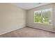 Bedroom with neutral paint, carpet and a window letting in ample natural light at 633 Alwyn Blvd, Summerville, SC 29485