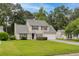 Charming two-story home with a well-manicured lawn, inviting curb appeal, and an attached garage at 633 Alwyn Blvd, Summerville, SC 29485