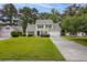 Charming two-story home with well-manicured front yard and inviting curb appeal at 633 Alwyn Blvd, Summerville, SC 29485