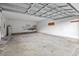 Spacious two car garage with concrete floor, white walls, and metal ceiling supports at 633 Alwyn Blvd, Summerville, SC 29485