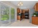 Functional kitchen with black appliances, tile backsplash and sliding door at 633 Alwyn Blvd, Summerville, SC 29485