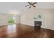 Open-concept living room with vaulted ceilings, hardwood floors, and cozy fireplace at 633 Alwyn Blvd, Summerville, SC 29485