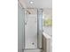 Clean bathroom featuring an enclosed glass shower and a tub with a large window and blinds at 633 Alwyn Blvd, Summerville, SC 29485
