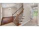 Carpeted staircase with wood railings, adjacent to hardwood floors in the living room at 633 Alwyn Blvd, Summerville, SC 29485