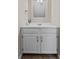 White vanity with matching mirror, and tan walls at 633 Alwyn Blvd, Summerville, SC 29485