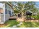 Back deck features a grill, outdoor seating, and a nice view of the spacious yard at 689 Port Cir, Charleston, SC 29412