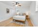 Light and airy bedroom with a wooden bed frame, hardwood floors, and a ceiling fan at 689 Port Cir, Charleston, SC 29412