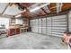 The large garage includes workbenches, storage, and a roll-up door at 689 Port Cir, Charleston, SC 29412