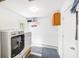 Spacious laundry room with modern washer and dryer units; door leading to outdoors at 689 Port Cir, Charleston, SC 29412