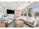 Sunroom with a plush white sectional sofa, natural textures, and an abundance of windows at 689 Port Cir, Charleston, SC 29412