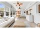Spacious sunroom featuring a sectional sofa, an ottoman, and windows on every wall at 689 Port Cir, Charleston, SC 29412