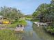 Scenic waterfront property featuring a dock, boat, kayak, and serene water views at 689 Port Cir, Charleston, SC 29412