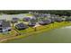 A waterfront neighborhood featuring homes with manicured lawns and lake views at 7011 Pumpkinseed Dr, Johns Island, SC 29455