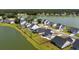 Waterfront community with well-maintained homes, expansive lawns, and serene lake views at 7011 Pumpkinseed Dr, Johns Island, SC 29455