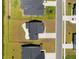 Aerial view of a home with a fenced yard, patio area, and a serene waterfront location at 7011 Pumpkinseed Dr, Johns Island, SC 29455