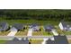 A beautiful aerial view of the property, showcasing the home's placement near a lake and lush greenery at 7011 Pumpkinseed Dr, Johns Island, SC 29455