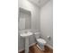 Compact half bathroom with pedestal sink and modern fixtures at 7011 Pumpkinseed Dr, Johns Island, SC 29455