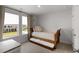 Cozy bedroom with a twin daybed, neutral carpet and curtains, and plenty of natural light at 7011 Pumpkinseed Dr, Johns Island, SC 29455