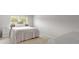 Cozy bedroom with a large bed, bedside table, and neutral colors at 7011 Pumpkinseed Dr, Johns Island, SC 29455