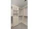 Walk-in closet with custom shelving, drawers, and ample storage space for clothes and accessories at 7011 Pumpkinseed Dr, Johns Island, SC 29455