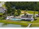 Community pool and recreation area with lakeside access and playground at 7011 Pumpkinseed Dr, Johns Island, SC 29455