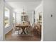 Elegant dining room with hardwood floors, a chandelier, and ample seating for formal gatherings at 7011 Pumpkinseed Dr, Johns Island, SC 29455