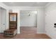 Hallway with hardwood floors and an elegant wooden storage cabinet at 7011 Pumpkinseed Dr, Johns Island, SC 29455