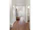 Inviting hallway with hardwood floors and decorative furnishings at 7011 Pumpkinseed Dr, Johns Island, SC 29455