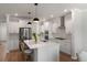 Modern kitchen with stainless steel appliances, a large island, and pristine white cabinetry at 7011 Pumpkinseed Dr, Johns Island, SC 29455