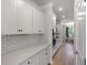 Modern kitchen featuring white cabinets, stainless steel appliances, and sleek countertops at 7011 Pumpkinseed Dr, Johns Island, SC 29455