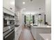 Bright, white kitchen with stainless steel appliances and a spacious island at 7011 Pumpkinseed Dr, Johns Island, SC 29455