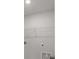 Functional laundry room with white wire shelving, utility connections, and easy access at 7011 Pumpkinseed Dr, Johns Island, SC 29455
