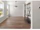 Open-concept living area with hardwood floors, large windows, and ample space for living at 7011 Pumpkinseed Dr, Johns Island, SC 29455