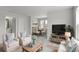 Comfortable living room with ample seating and open concept to dining area at 7011 Pumpkinseed Dr, Johns Island, SC 29455