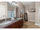 Bathroom with dual sinks, granite countertops, and shower at 7030 Billberry St, Hanahan, SC 29410