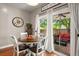 A charming dining nook with large windows and access to the backyard patio at 7030 Billberry St, Hanahan, SC 29410
