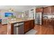 Open kitchen with granite countertops, stainless steel appliances, and breakfast bar seating at 7030 Billberry St, Hanahan, SC 29410