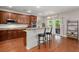 Kitchen with island, granite countertops, stainless appliances, and access to the outdoor patio at 7030 Billberry St, Hanahan, SC 29410