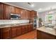 An open kitchen shows granite countertops and stainless steel appliances at 7030 Billberry St, Hanahan, SC 29410