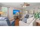 Cozy living room featuring hardwood floors, comfortable sofas, and natural light at 7030 Billberry St, Hanahan, SC 29410