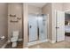 Bathroom featuring a glass door shower and a toilet at 7030 Billberry St, Hanahan, SC 29410